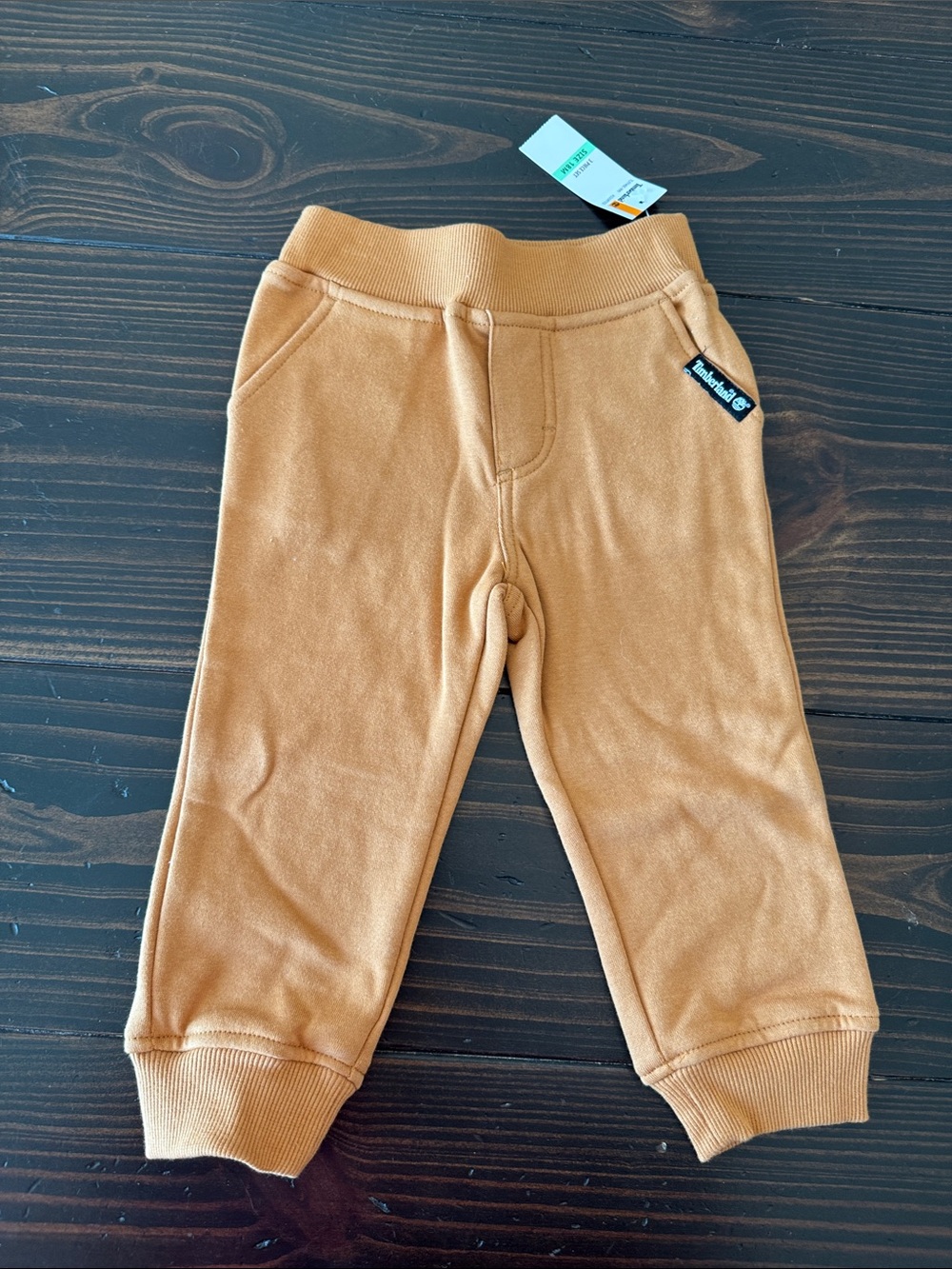 Timberland Kids Black & Cream Puffer Vest with Gray Logo Tee and Tan Joggers - Picture 7 of 8